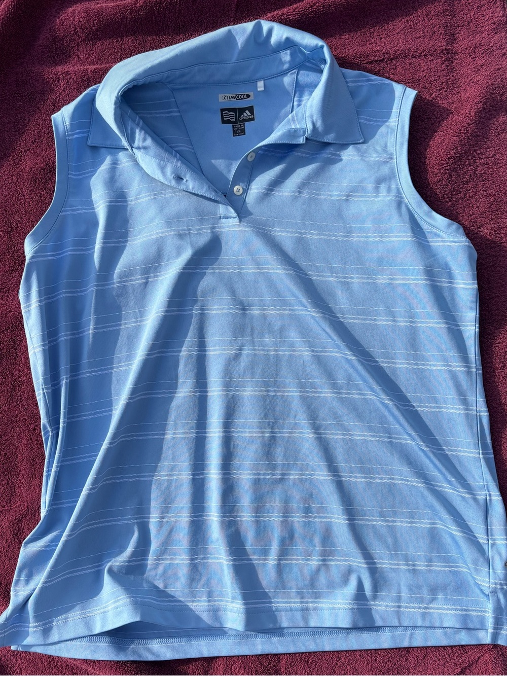 adidas women’s Light Blue Sleeveless Polo with white Stripes